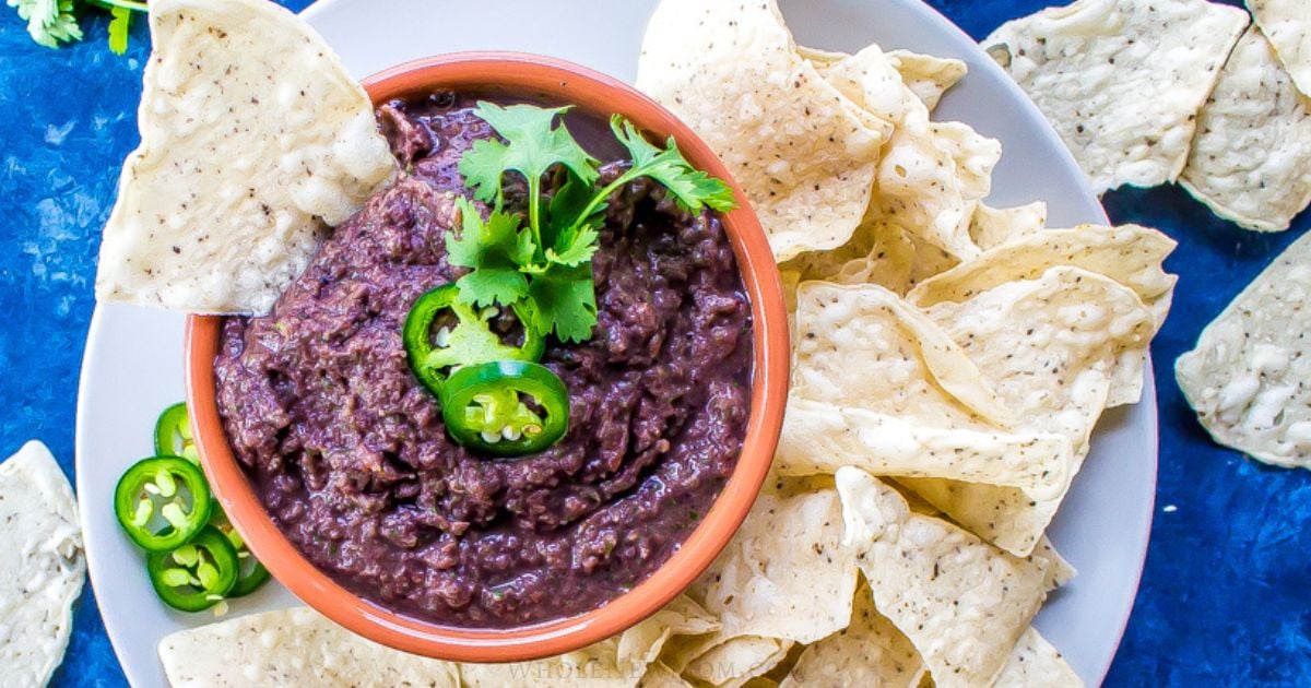 black bean dip with a plate of chips.