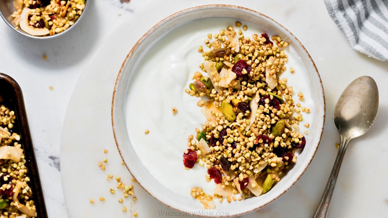 buckwheat granola with yogurt in white bowl.
