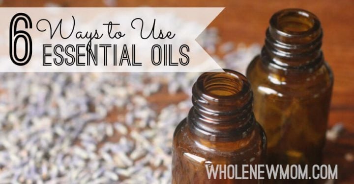 essential oil bottles with lavender in background