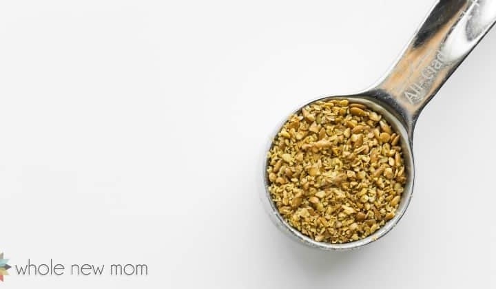 golden flax seeds in measuring spoon for vegan flax egg