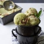 fresh mint chocolate ice cream in black speckled cups.