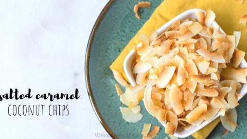 Salted Caramel Toasted Coconut Chips in a white square bowl on top of a yellow napkin on green plate