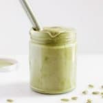 homemade pumpkin seed butter in glass jar with spoon