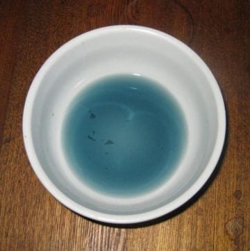 blue food coloring in a small bowl
