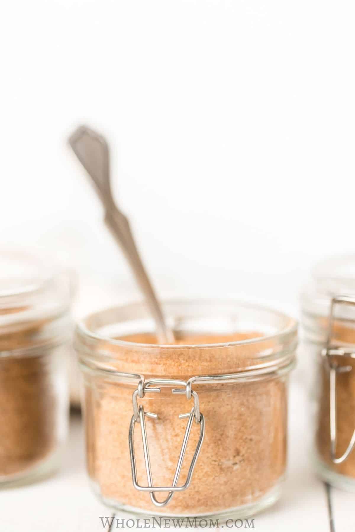 cinnamon sugar in glass container with spoon