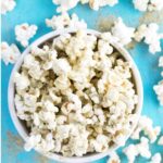 popcorn with healthy popcorn seasoning in white bowl.