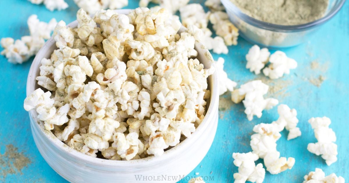 popcorn topped with seasoning in a white bowl.