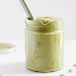 pumpkin seed butter in clear glass jar.