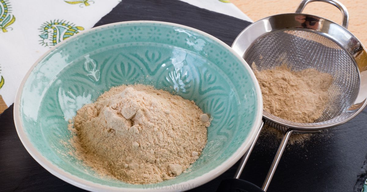 unrefined sugar in a bowl and a sifter.