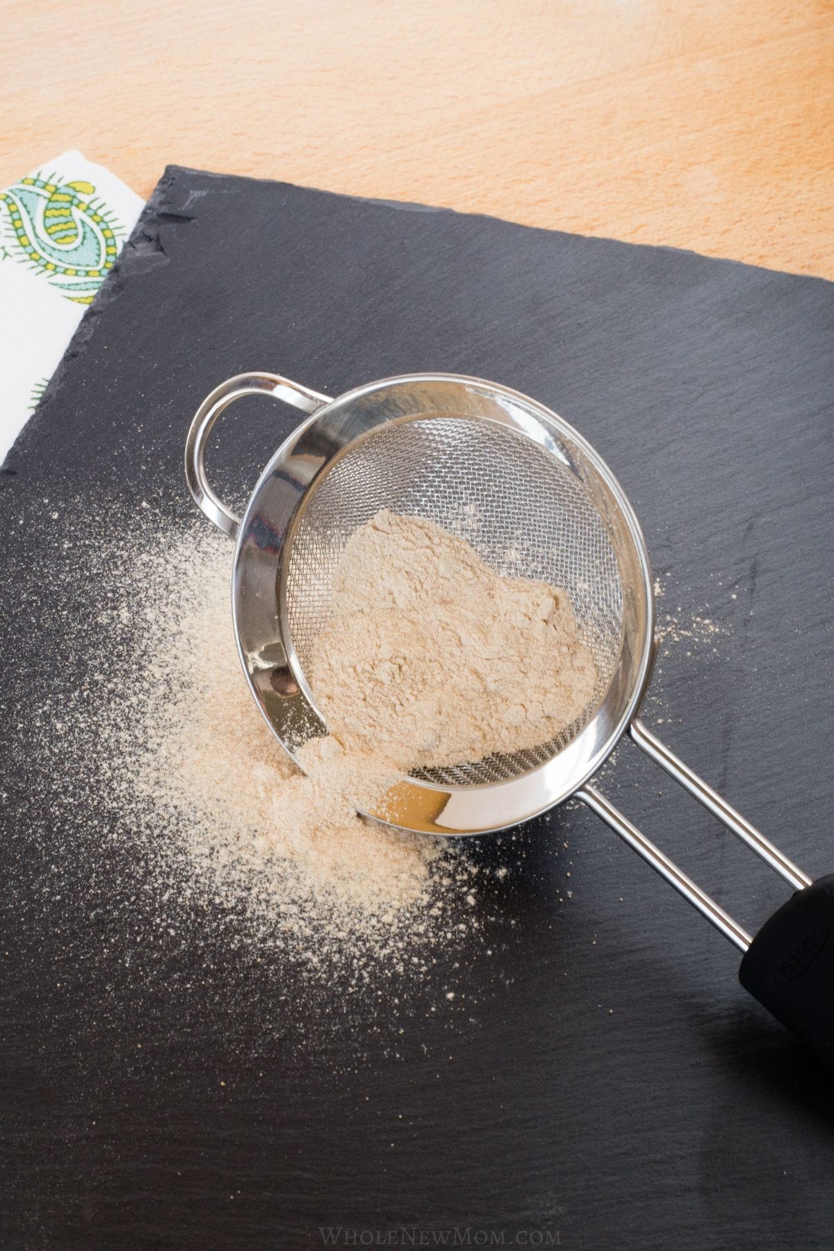 unrefined sugar in a sifter.