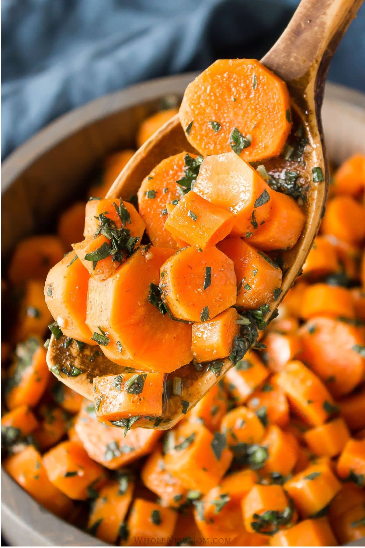 moroccan carrot salad in wooden bowl.