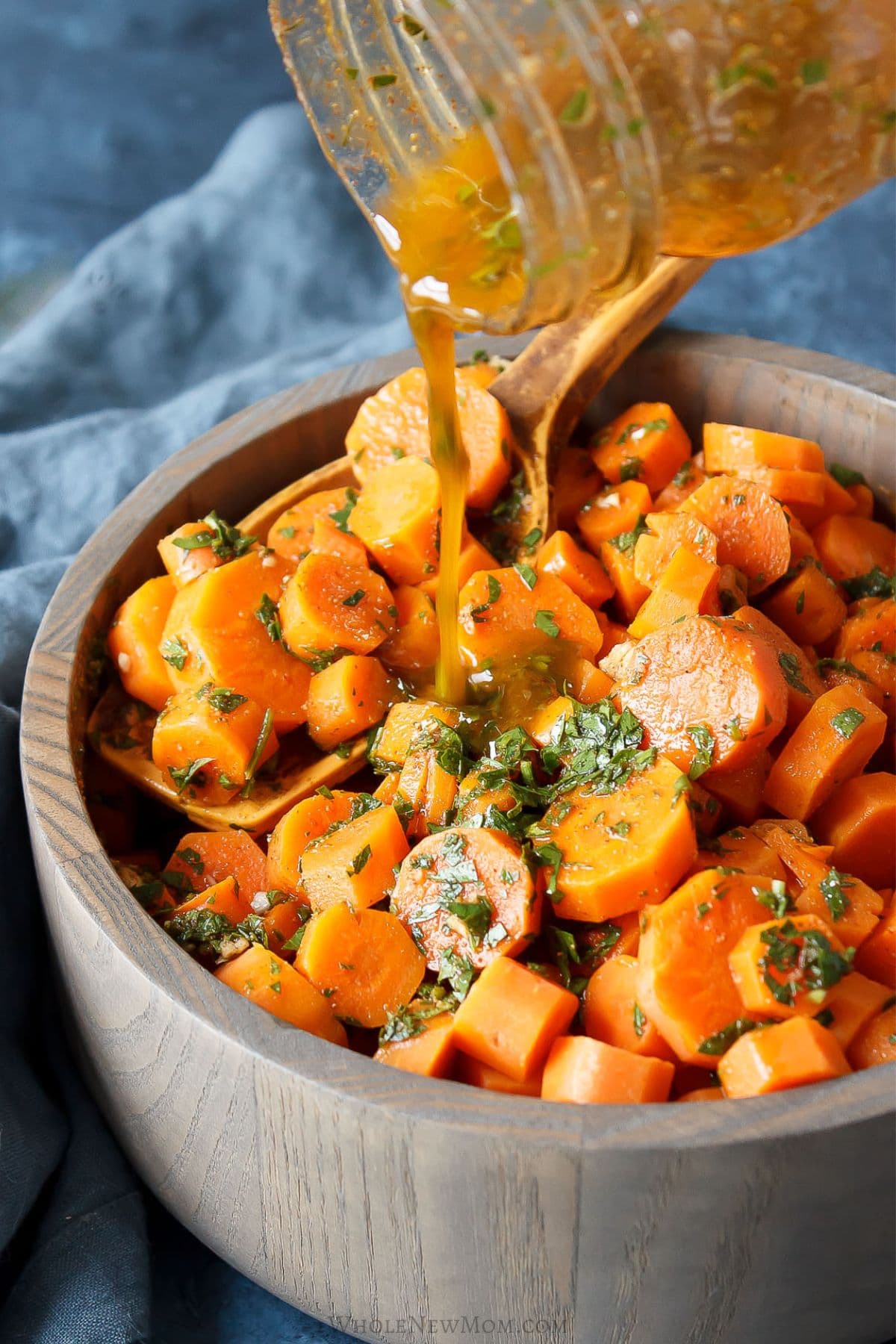 moroccan carrot salad in wood bowl.