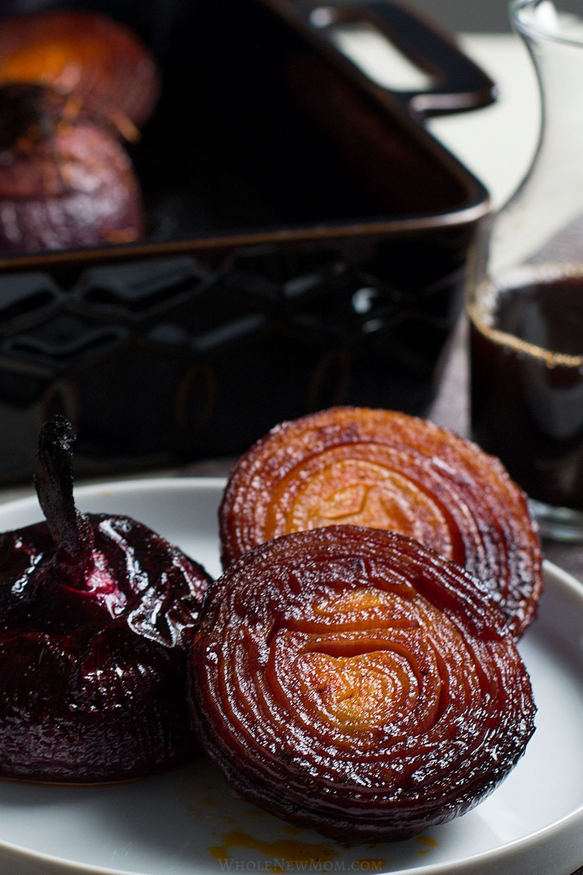 baked balsamic onions on white plate.