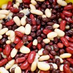 cooked beans in a colander.