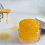 diy honey lip scrub in small jar.