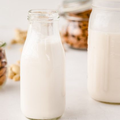 homemade almond milk in small glass jar.