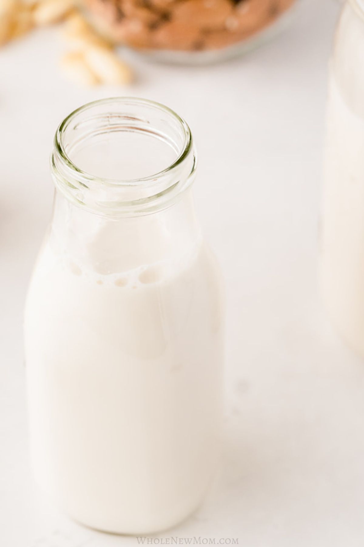 homemade almond milk in small glass jar.