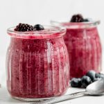 mixed berry chia pudding in glass dessert cups.