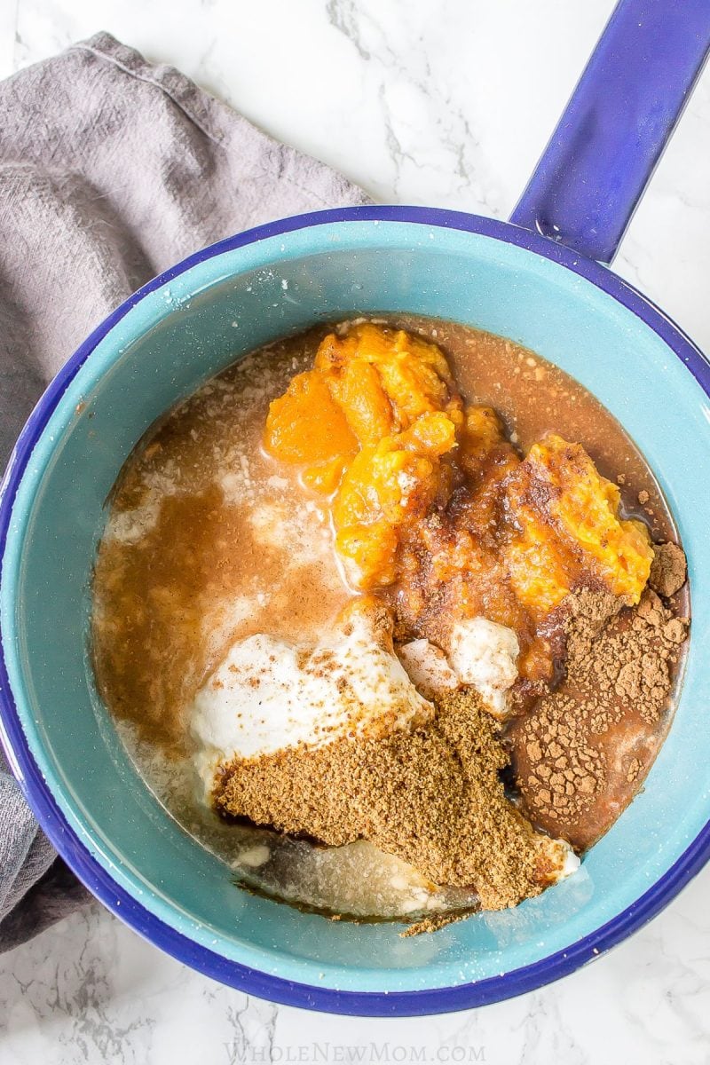 ingredients for pumpkin custard in blue pot.