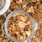 sugar-free granola in jar on top of baking pan with more granola.