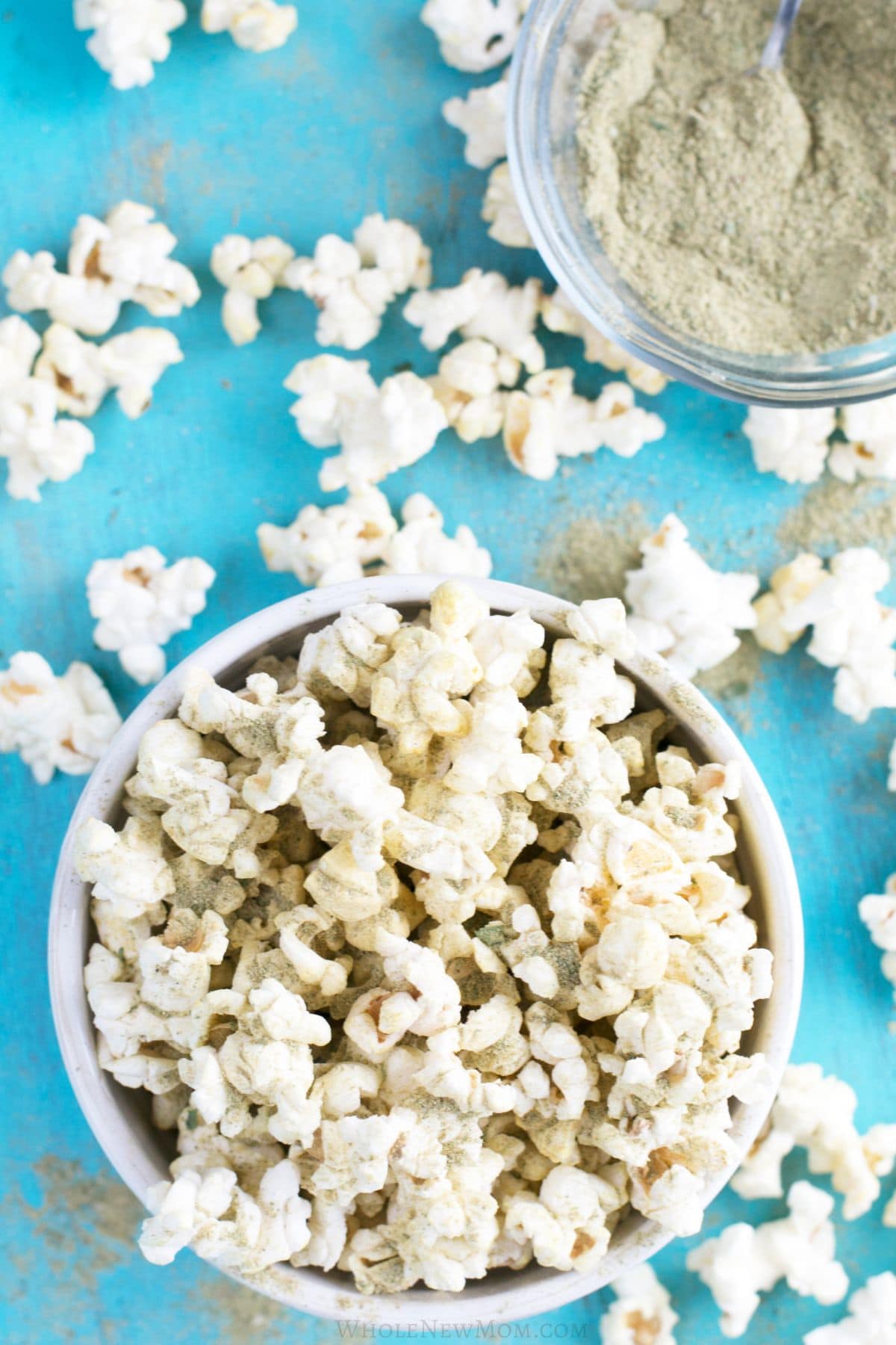 homemade popcorn seasoning on popcorn in white bowl.