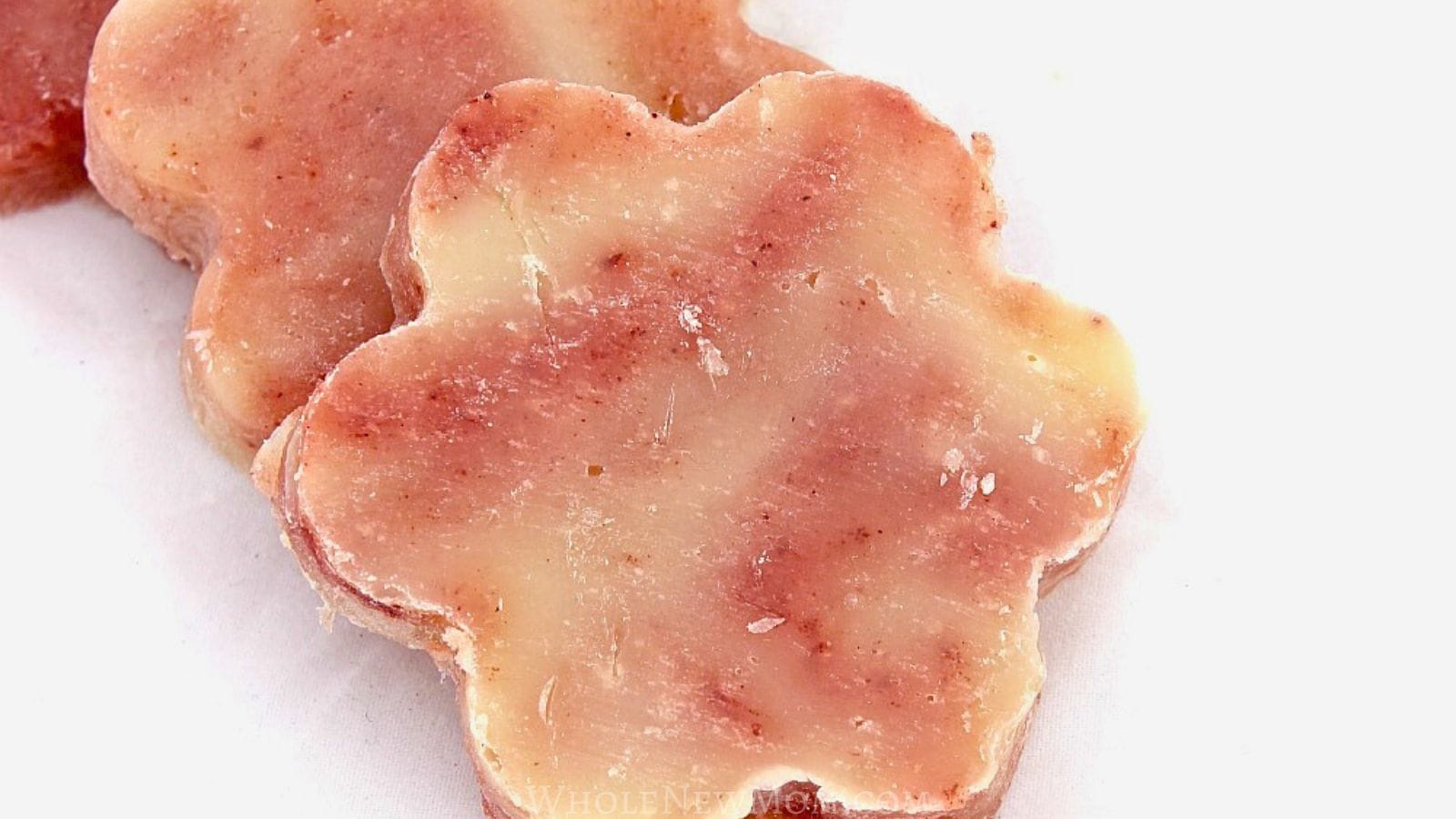 homemade melt and pour soap without lye molded in flower shapes.