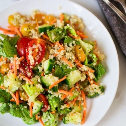 garden quinoa salad on white plate.