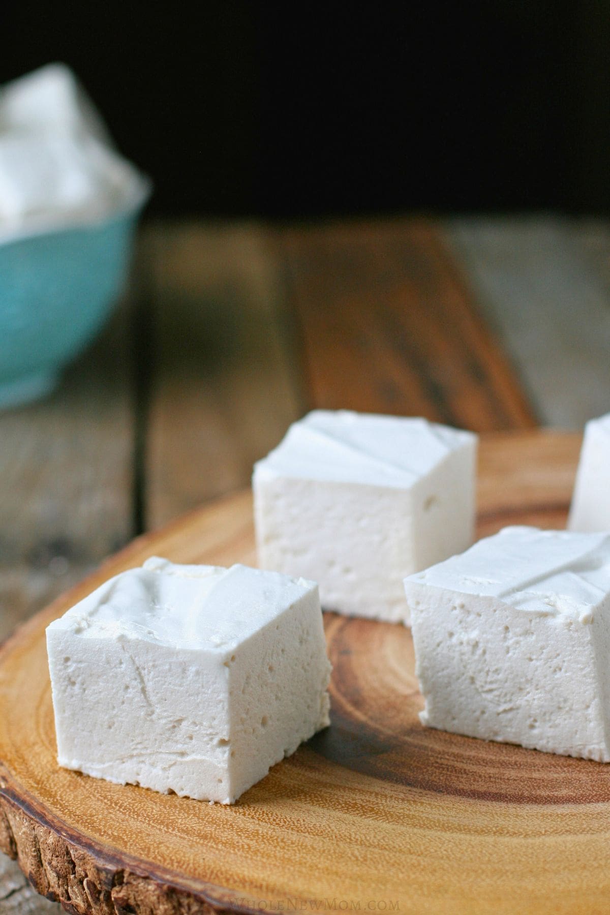 sugar-free marshmallows on wood platter.