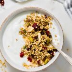 buckwheat granola in bowl on top of yogurt.