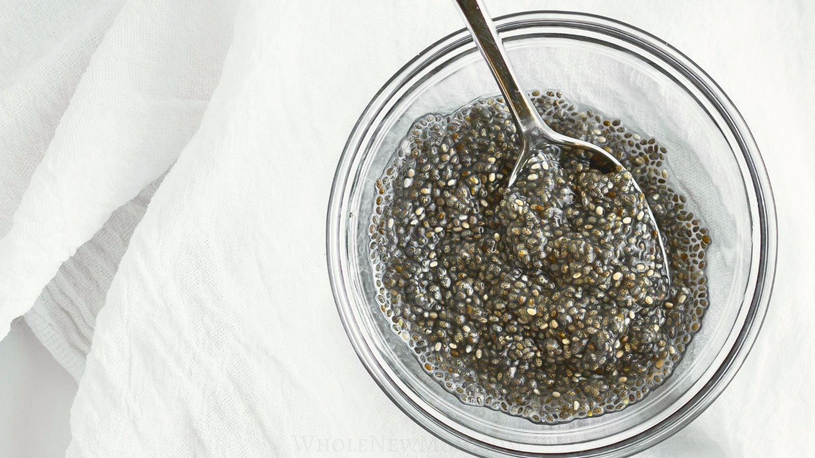 chia egg with spoon in small glass bowl.