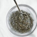 chia egg with spoon in small glass bowl.