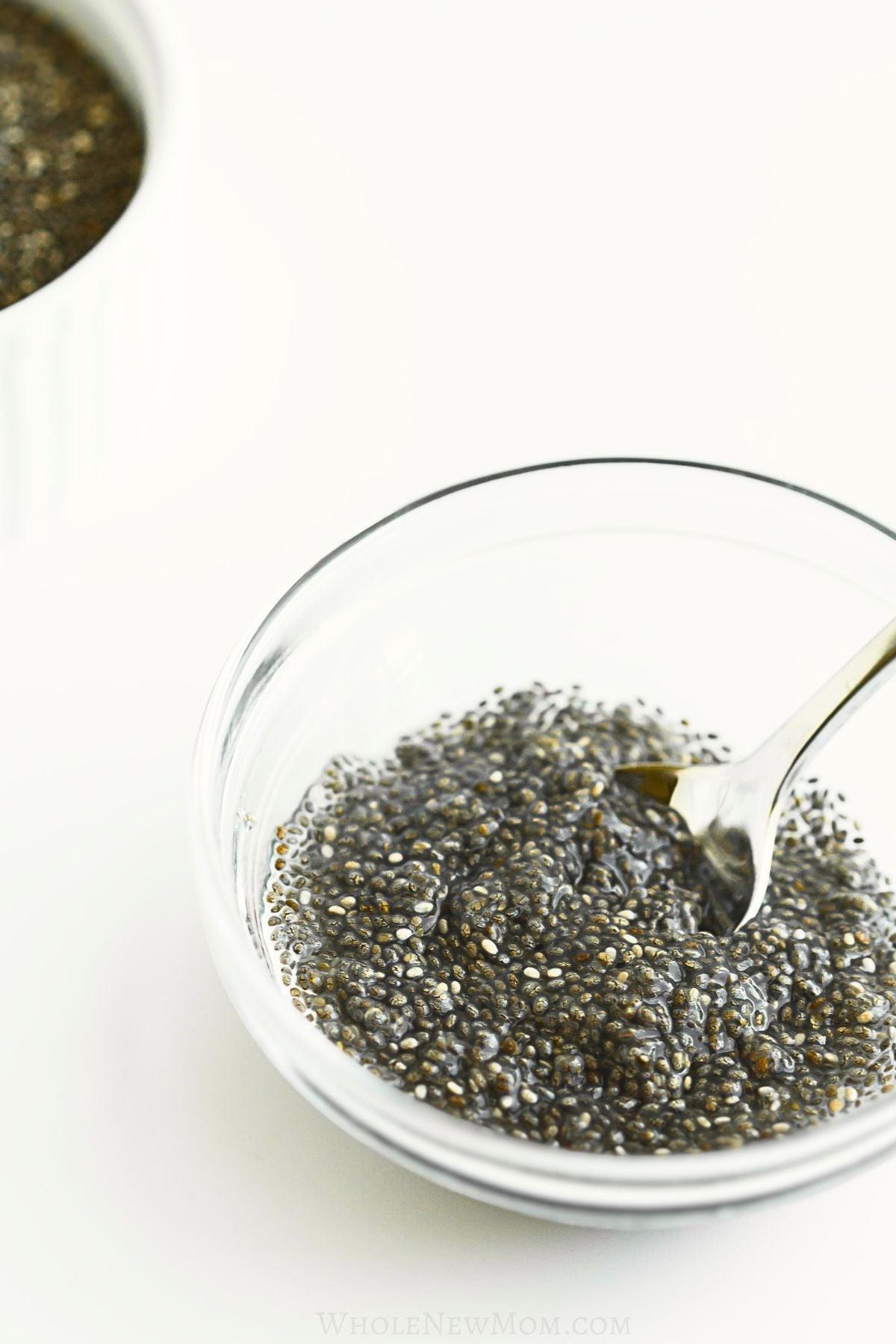 chia egg with spoon in small glass bowl.