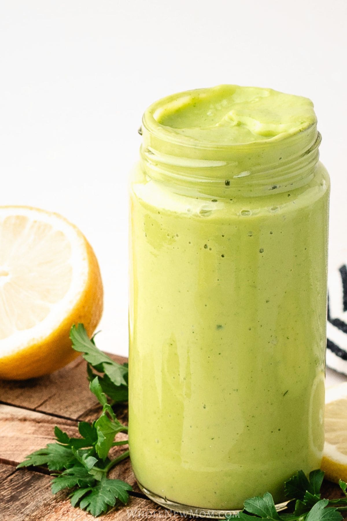 thick creamy avocado dressing in jar.