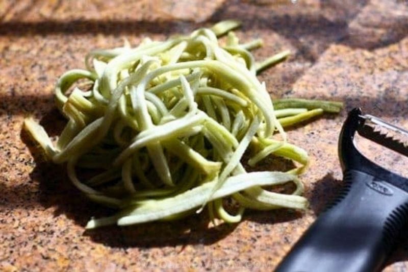 Eggplant noodles cut into thin strips using a julienne peeler.