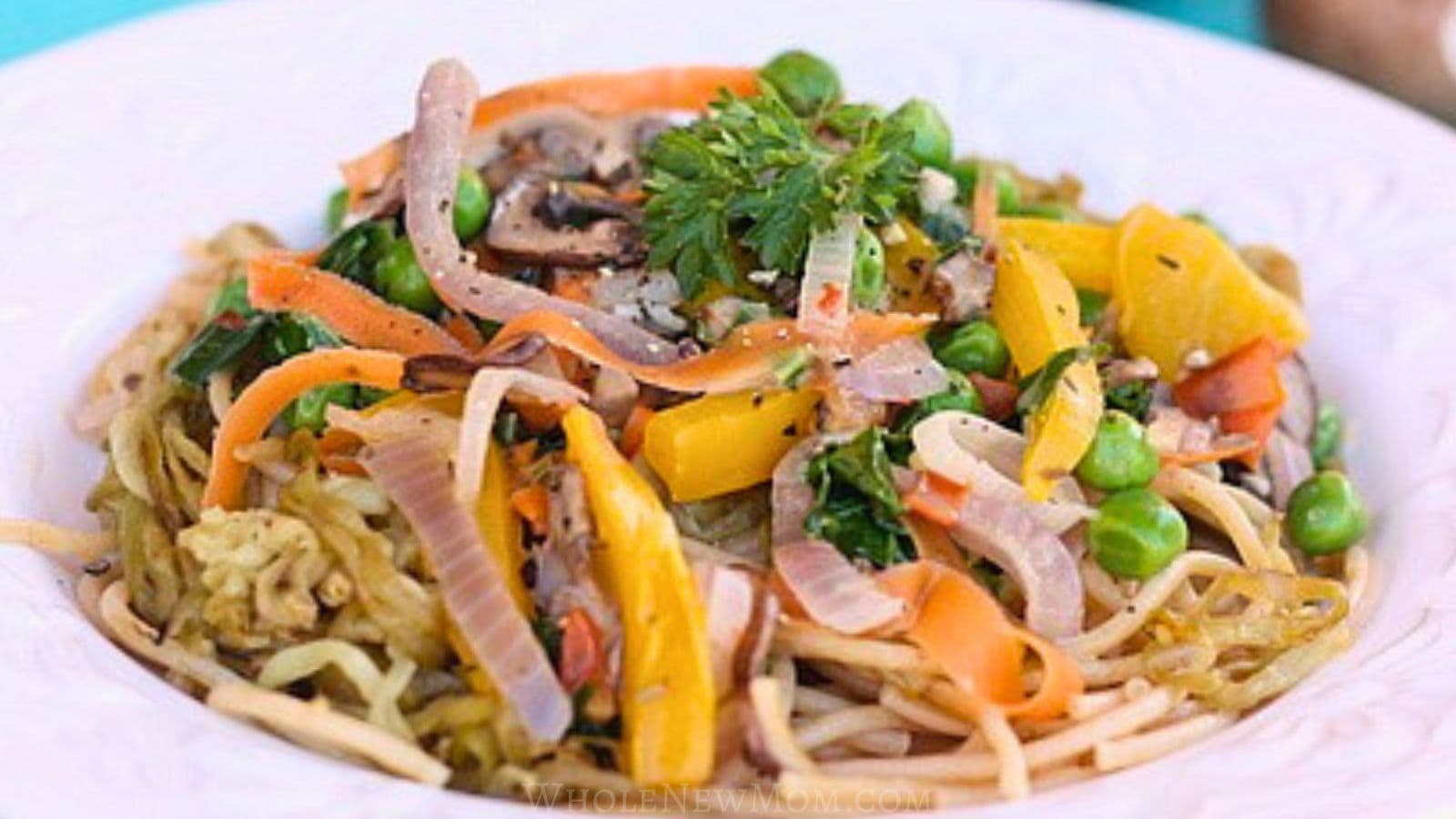 eggplant noodles with vegetables in white bowl.