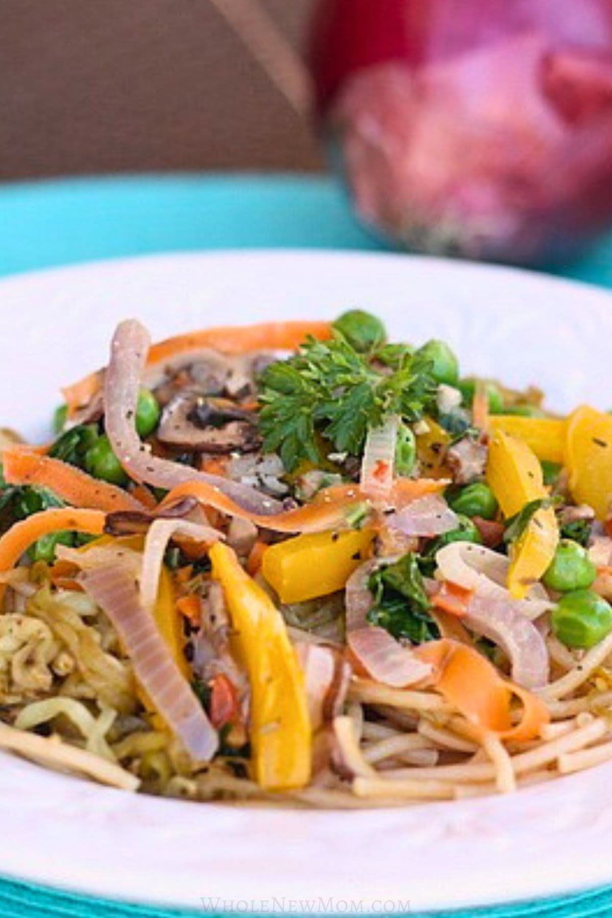 eggplant noodles with vegetables in white bowl.