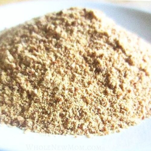 homemade granulated garlic on white plate.