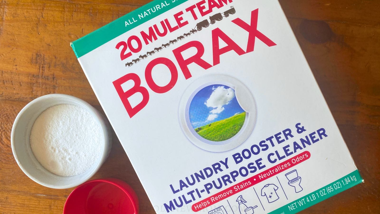 box of mule team borax with ramekin with borax and red measuring cup.