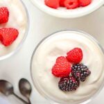 sugar free coconut pudding in dessert dish with berries.