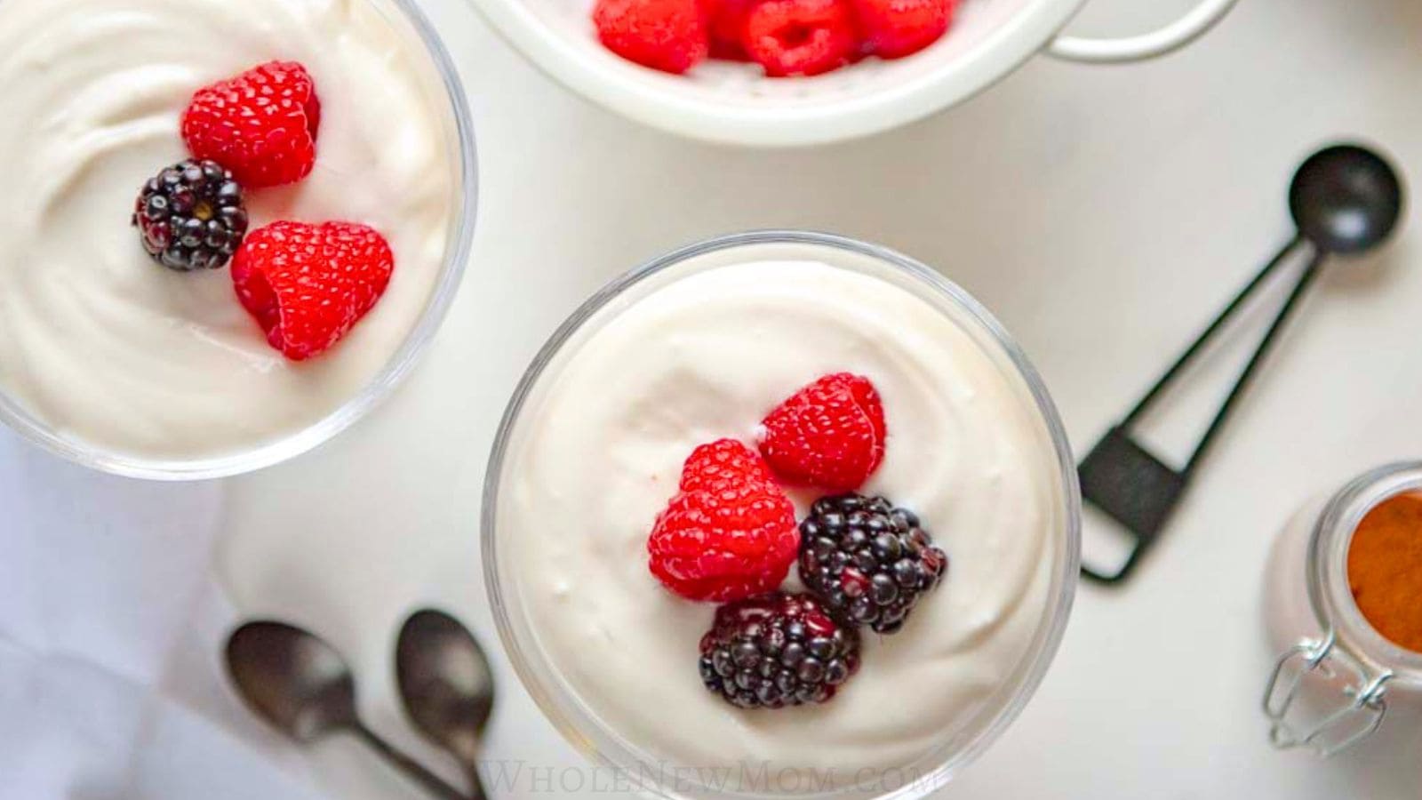 sugar free coconut pudding in dessert cups with berries.