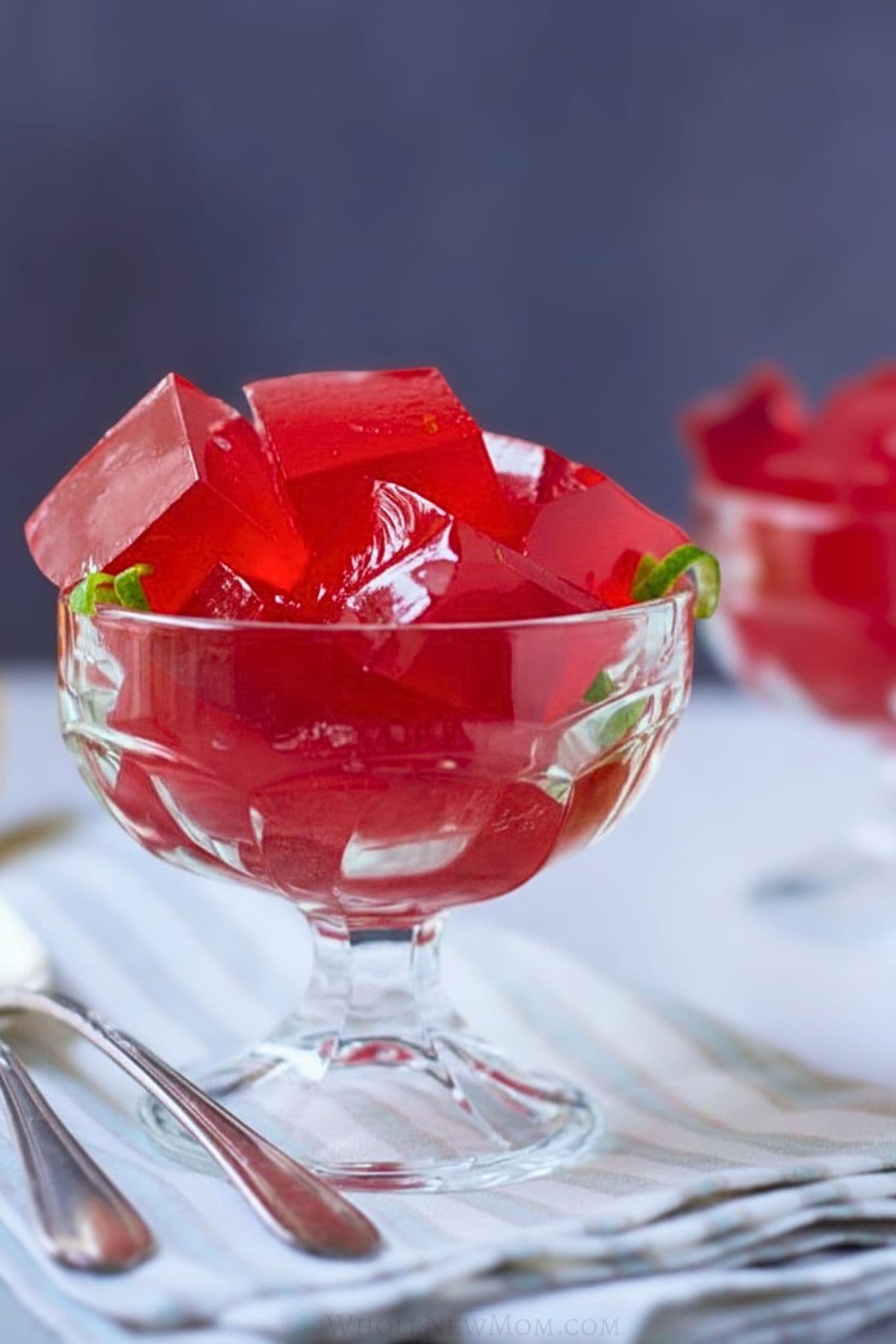 sugar free red jello in glass dessert dish.