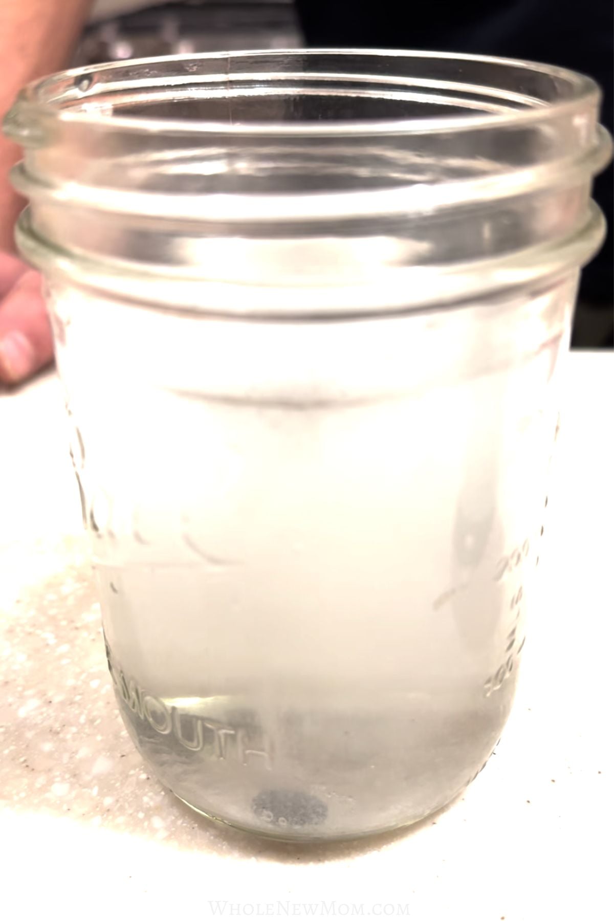 glass of water with hydrogen tablet dissolving in it.