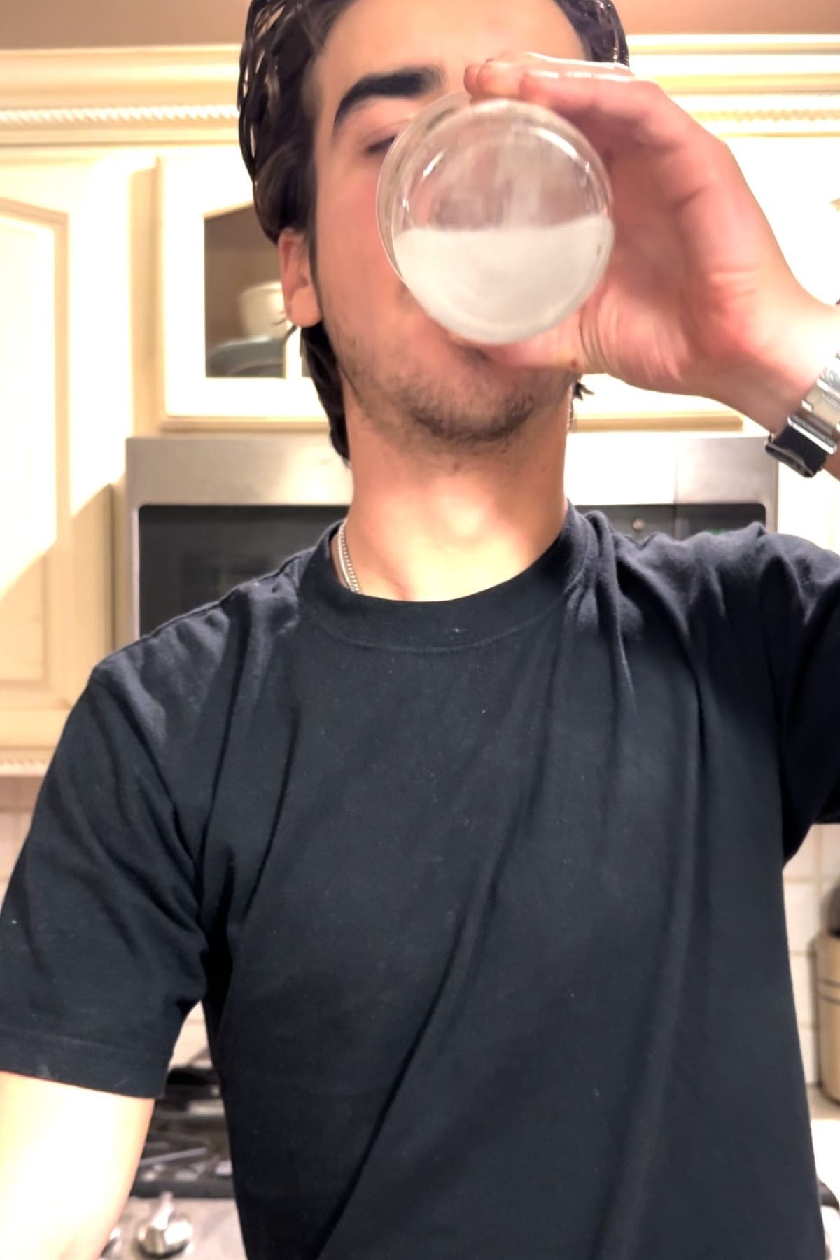 young man drinking hydrogen water made with a hydrogen tablet.