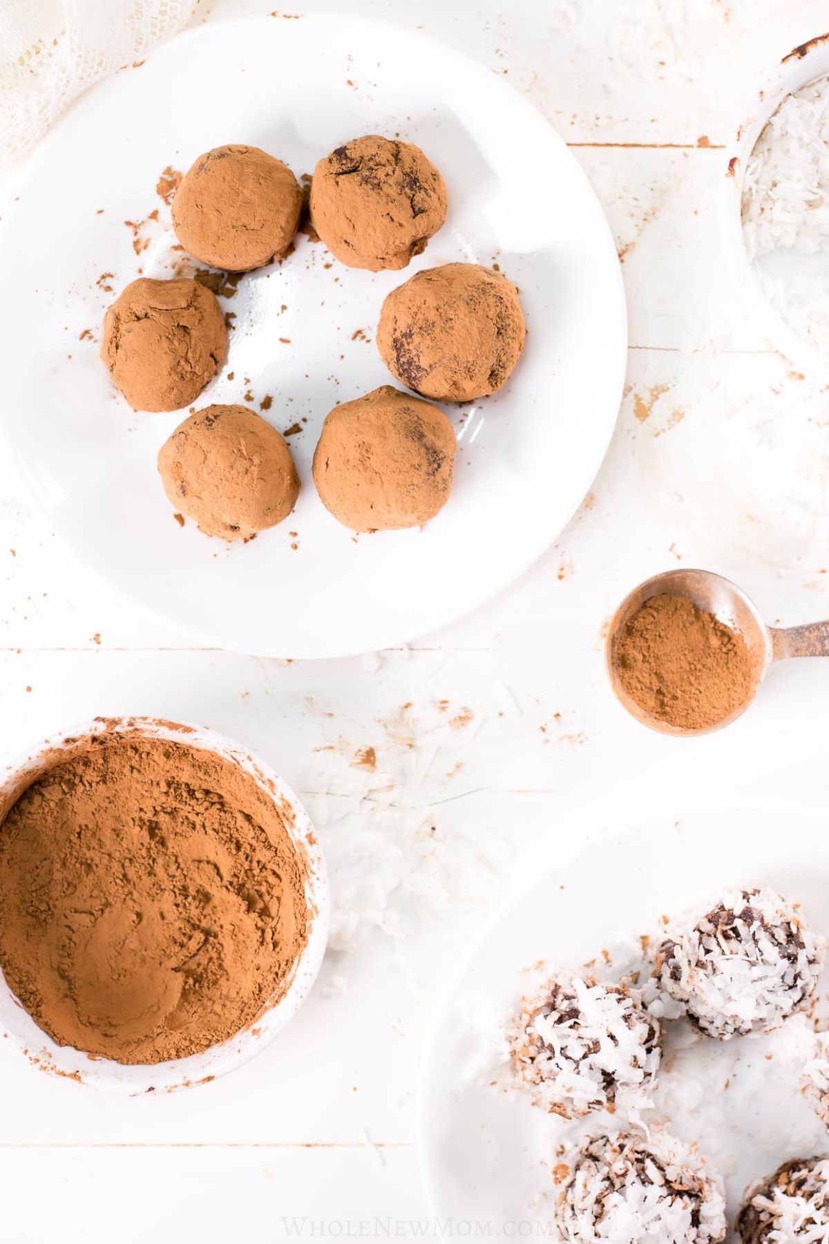 overhead view of chocolate avocado truffles on white plates.