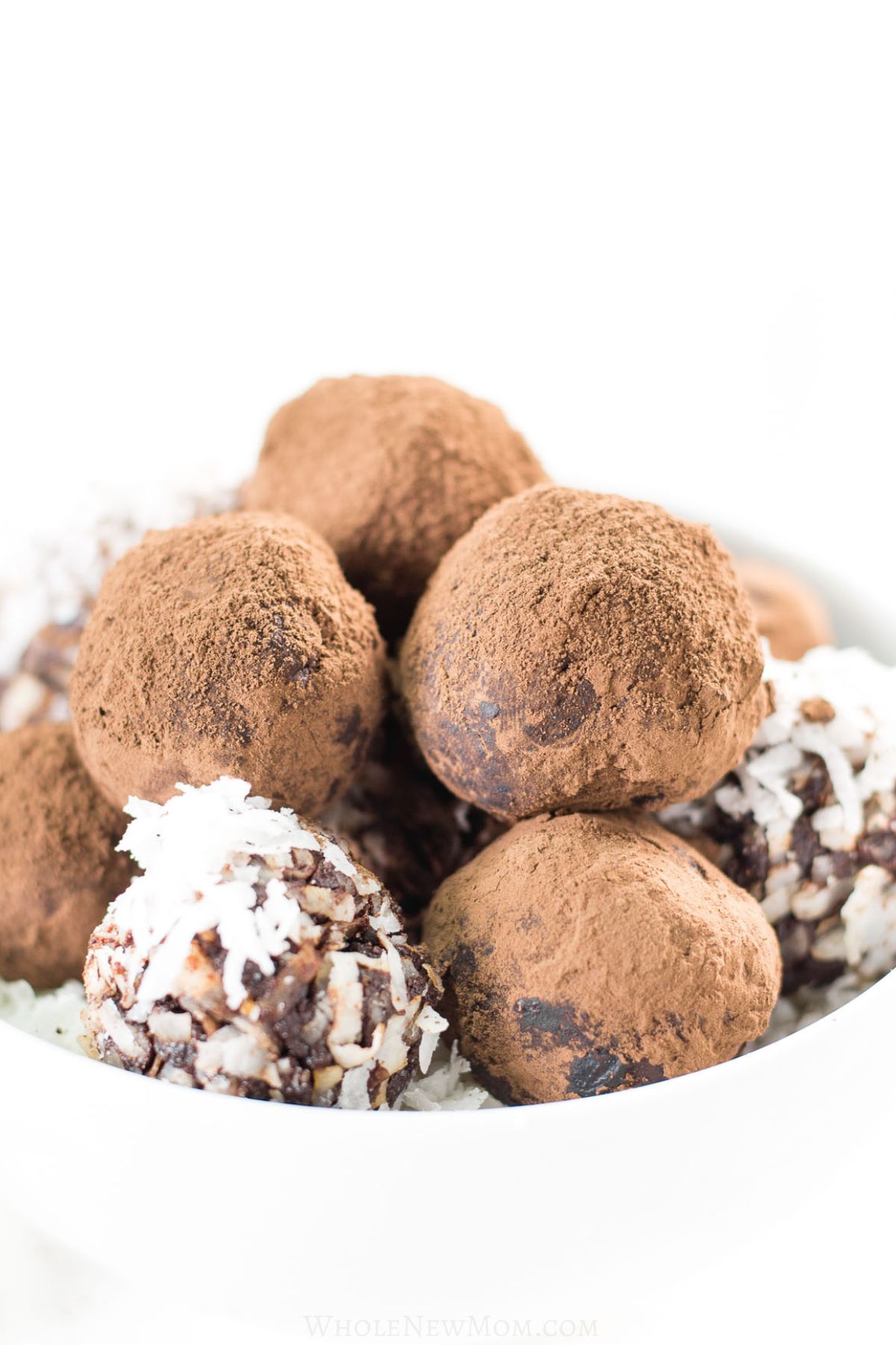 chocolate avocado truffles in white bowl.