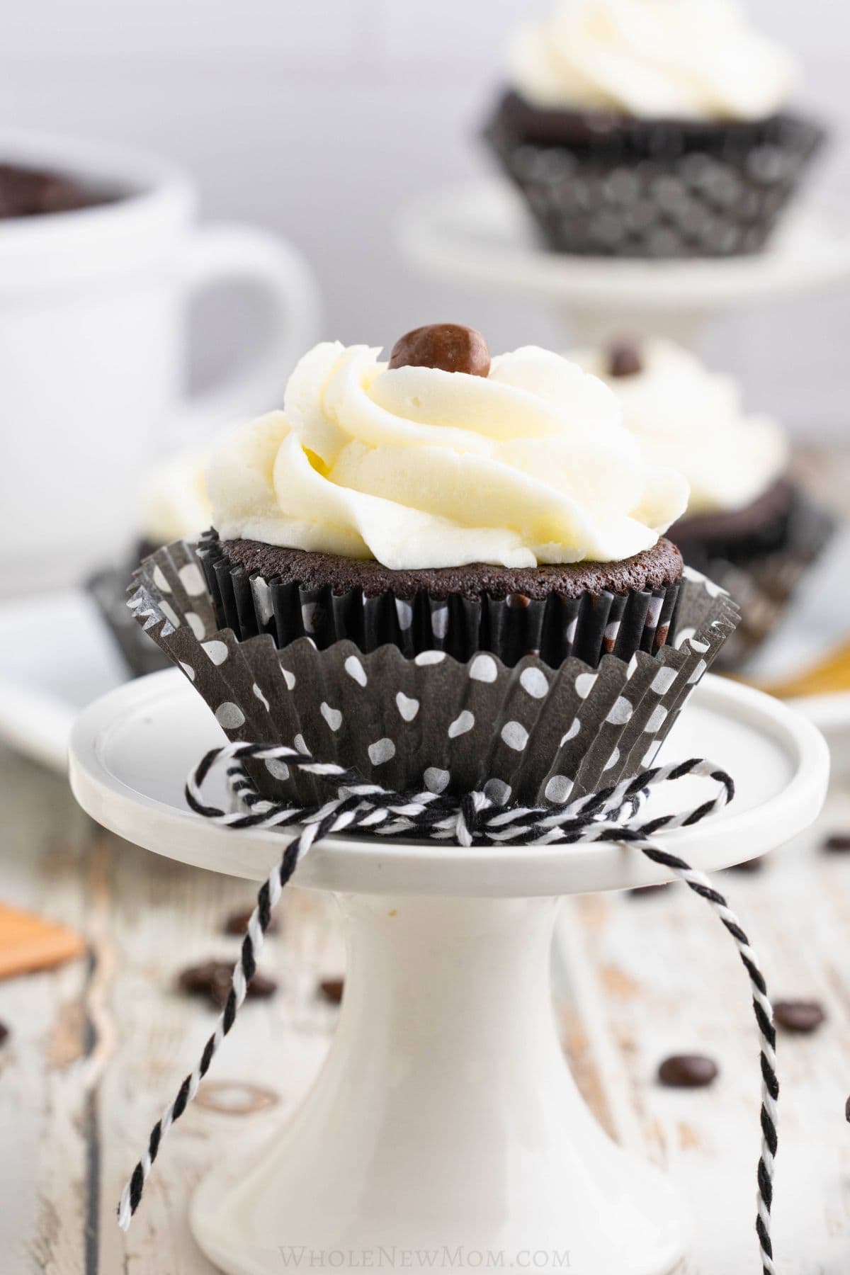 gluten free chocolate cupcake on stand.