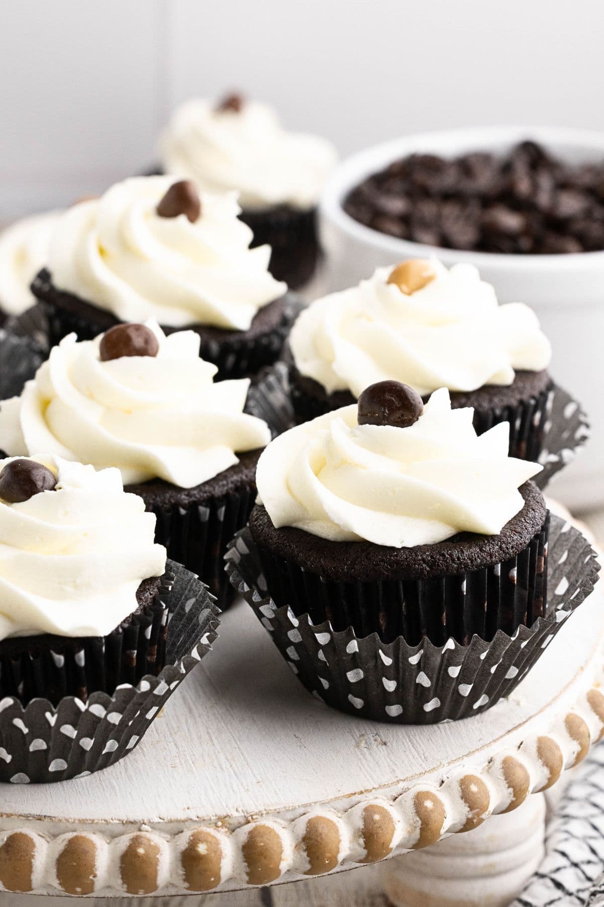 gluten free chocolate cupcakes on stand.