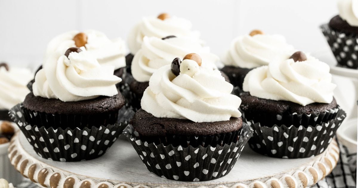 gluten free chocolate cupcakes on pedestal.