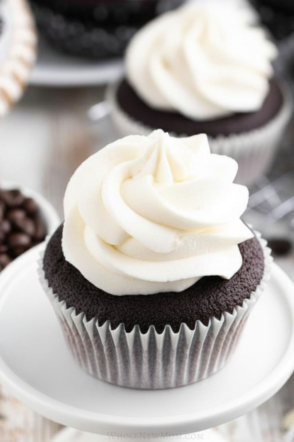 keto buttercream frosting on gluten free chocolate cupcakes.