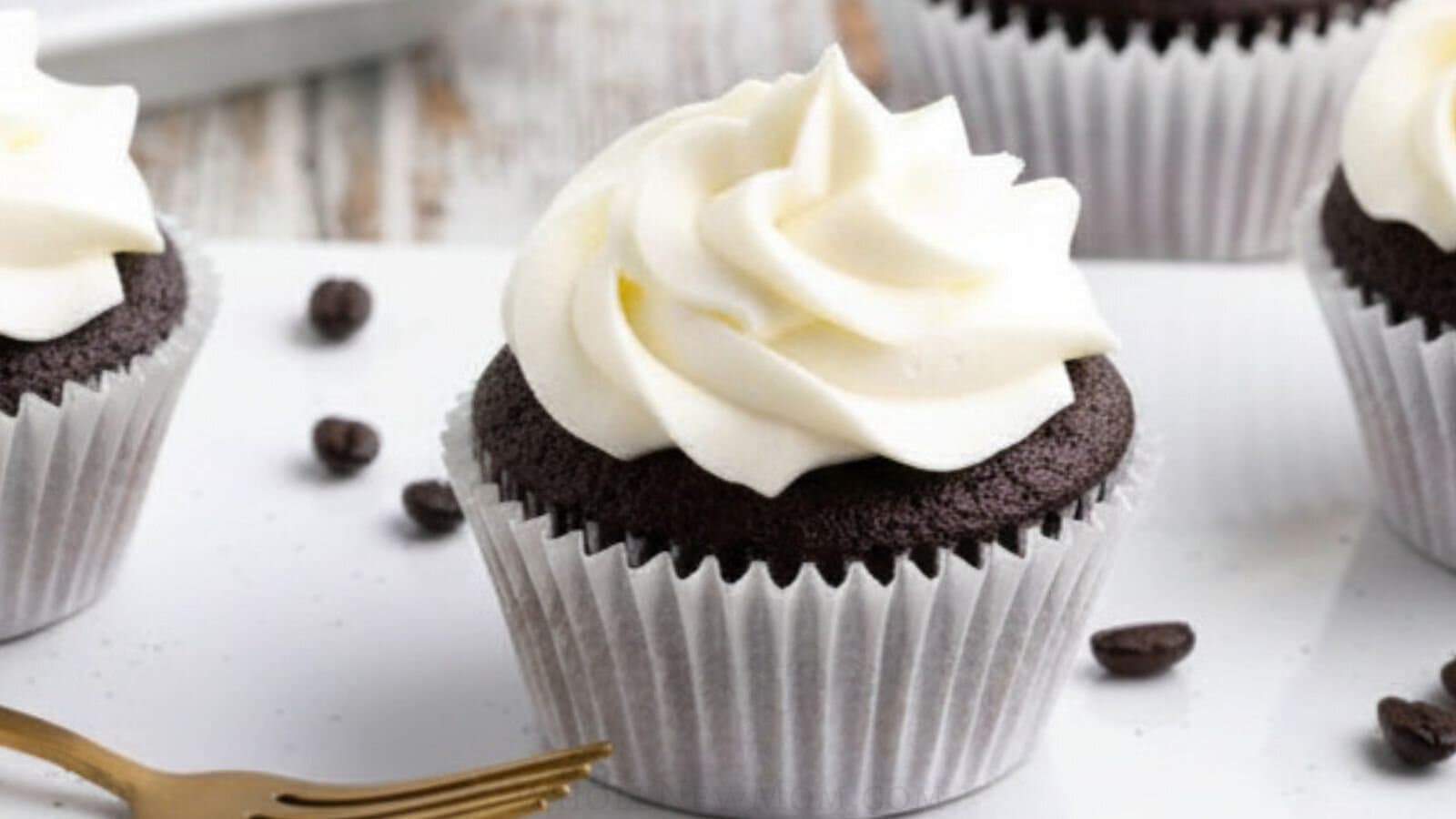 sugar free vanilla buttercream on gluten free chocolate cupcakes.